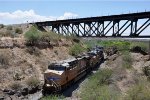 Manifest heads east under the bridge